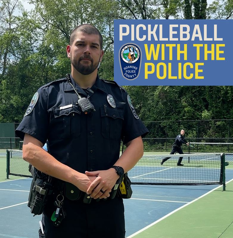 Police officer stands in front of a pickleball court